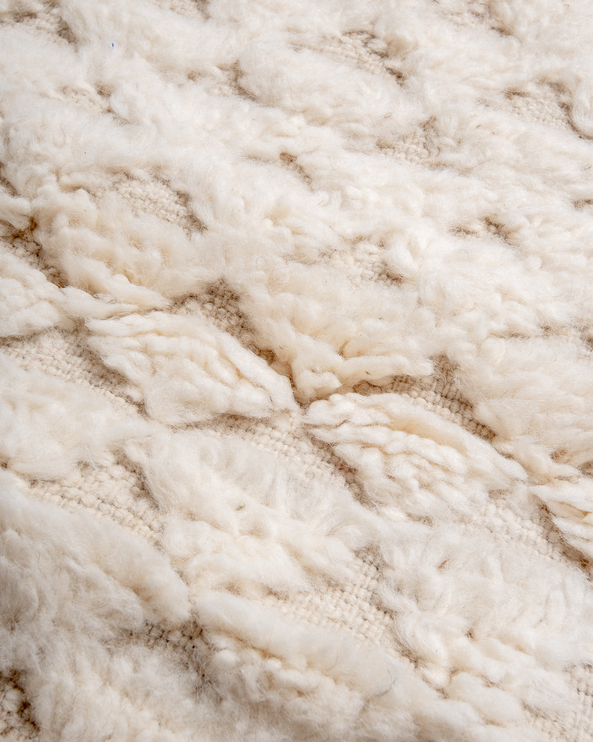 Modern, designer, handcrafted Berber rug from Morocco. Beniourain carpet with minimalist design, natural wool pile and a fluffy texture.